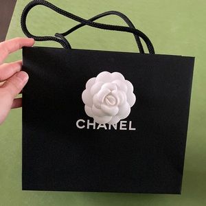 Authentic Chanel shopping bag with camellia flower